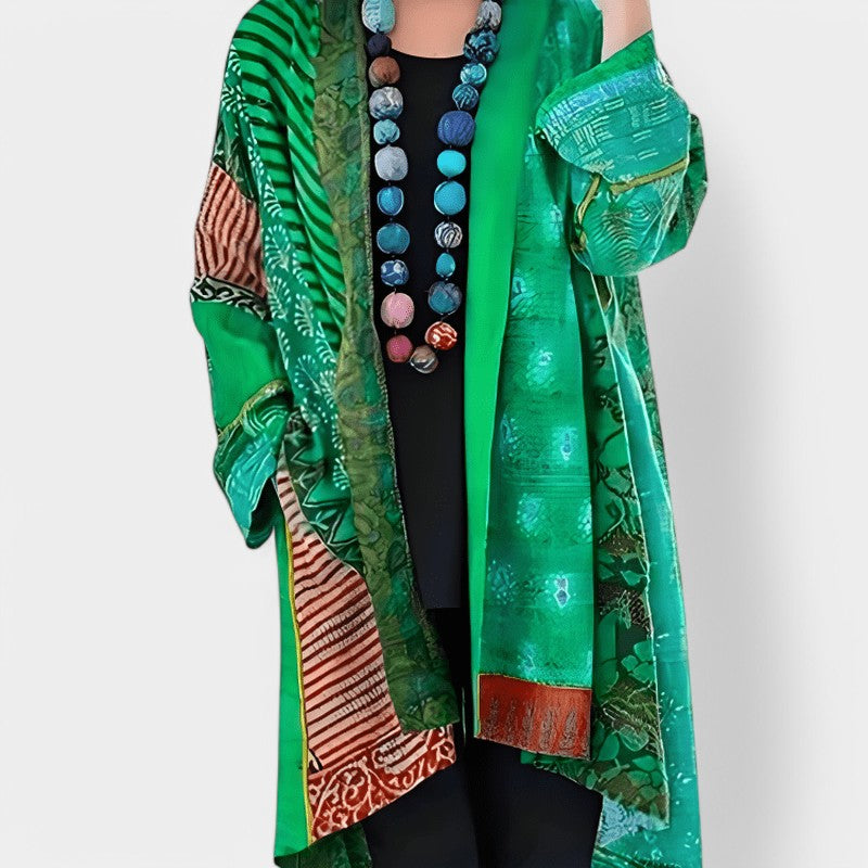 Gleame.-Gleame cape - Elegante open design cape