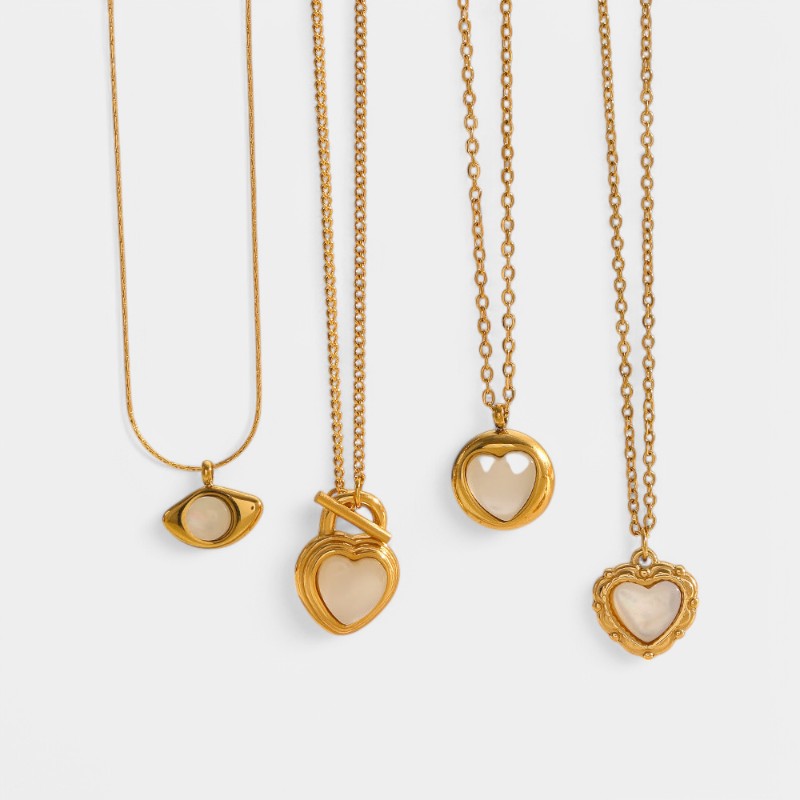 Gleame.-Sieraden-Gleame Ketting - 18k gouden titanium kattenoog hart hanger