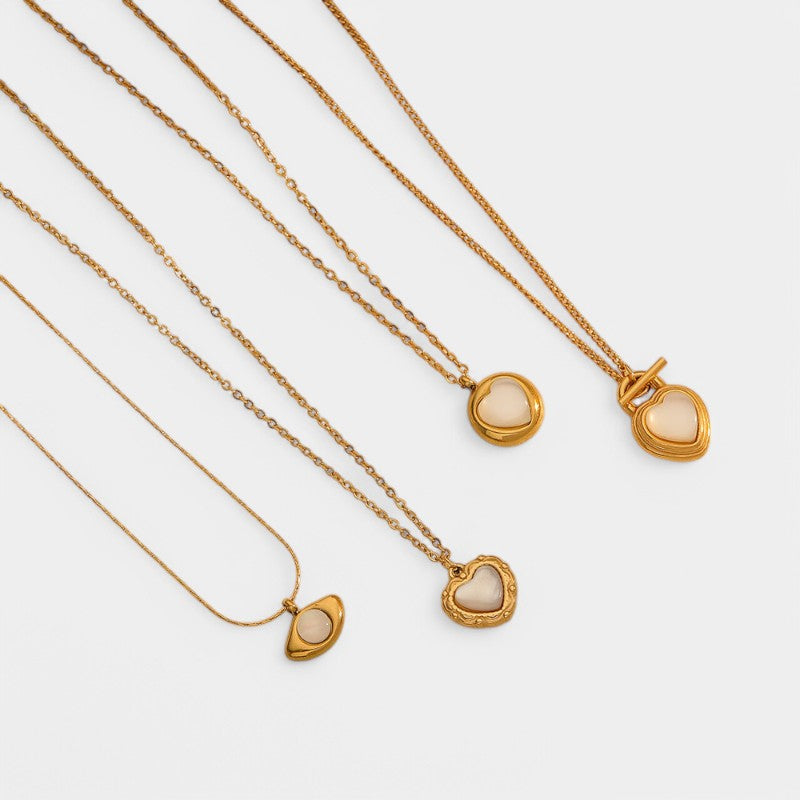 Gleame.-Sieraden-Gleame Ketting - 18k gouden titanium kattenoog hart hanger