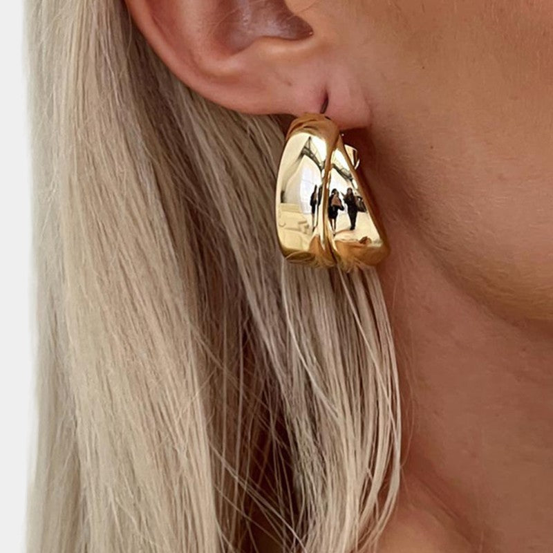 Gleame.-Sieraden-Gleame Oorbellen - Chunky double goud vergulde hoop earrings